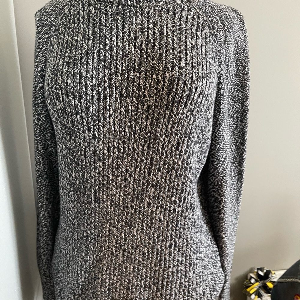 Turtle neck marled black and white sweater.